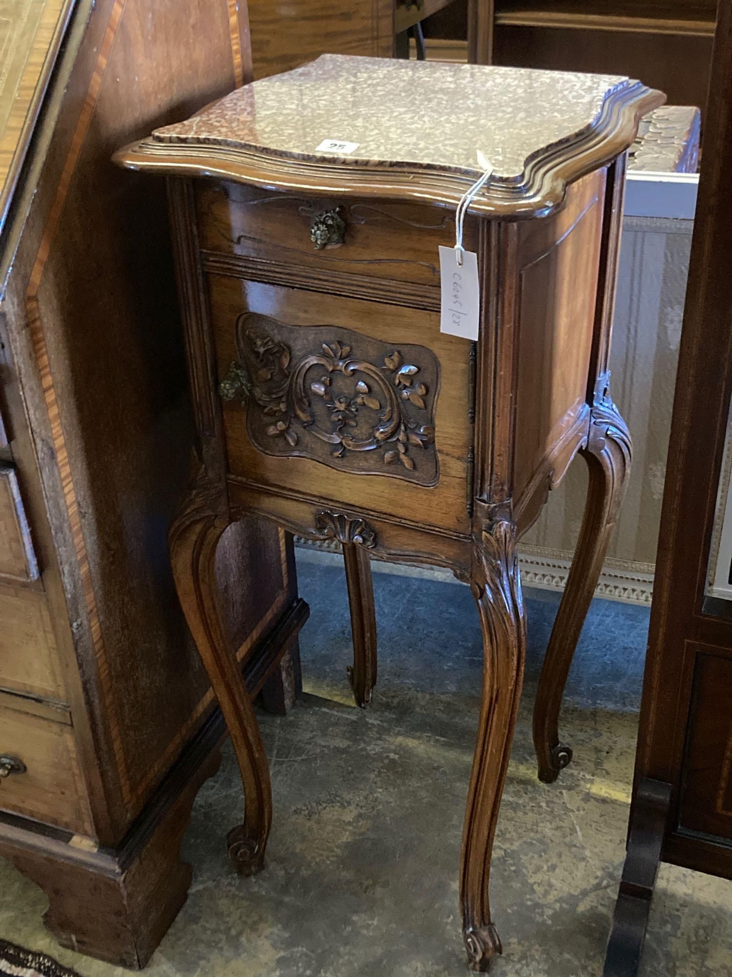 An Edwardian carved walnut bedside cabinet, with marble top and ceramic lined interior, width 41cm height 90cm